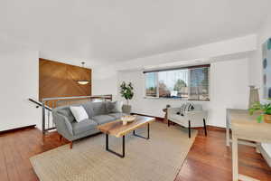 Living room featuring hardwood / wood-style flooring