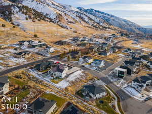 Snowy aerial view featuring a mountain view