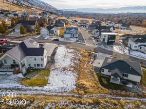 Snowy aerial view with a mountain view