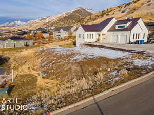 View of front facade featuring a mountain view and a garage