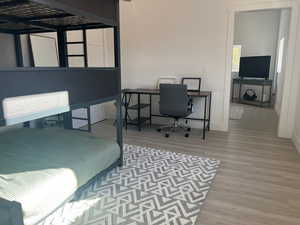 Bedroom featuring hardwood / wood-style floors