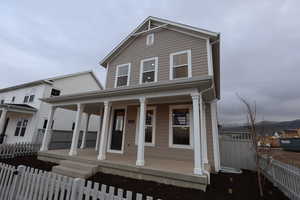 View of front of property with covered porch