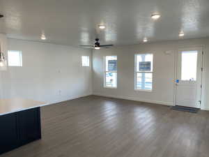 Living rooom featuring laminate flooring