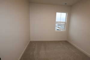 Guest bedroom with carpet floors