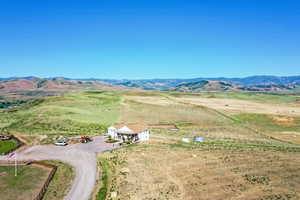 Birds eye view of property featuring a mountain view and a rural view