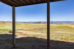 View of yard with a mountain view and a rural view