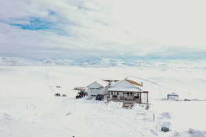 View of front of home with a mountain view and a garage