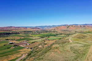 Birds eye view of property with a mountain view and a rural view