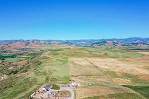 Birds eye view of property featuring a mountain view and a rural view