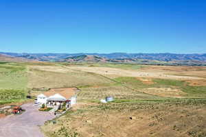 Drone / aerial view featuring a mountain view and a rural view