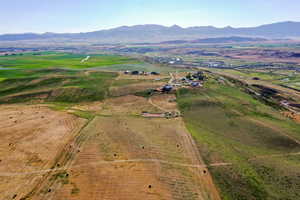 Birds eye view of property with a mountain view and a rural view