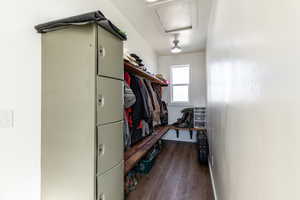 Interior space with dark hardwood / wood-style flooring