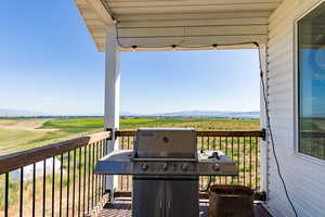 Deck featuring a mountain view and a rural view