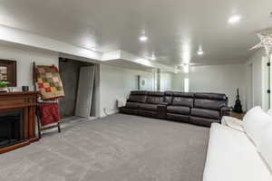 Living room with a textured ceiling and carpet floors