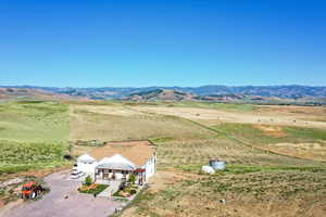 Birds eye view of property featuring a mountain view and a rural view