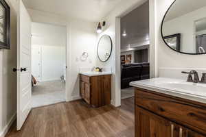 Bathroom featuring vanity and hardwood / wood-style flooring