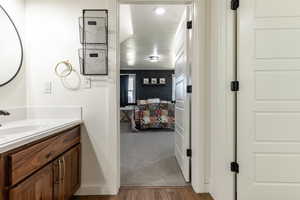 Bathroom with vanity and wood-type flooring