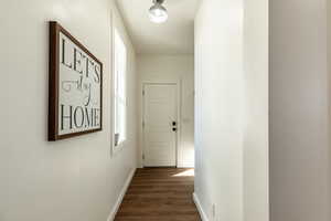 Corridor featuring dark hardwood / wood-style floors