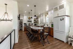 Dining space featuring dark hardwood / wood-style floors and sink