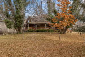 View of yard featuring a porch