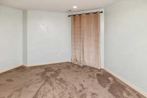 Spare room with carpet floors