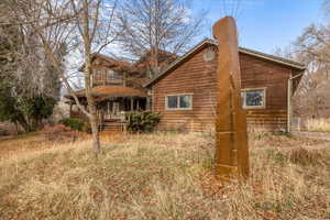 Rear view of property with a porch