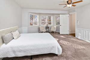 Bedroom with ceiling fan and carpet floors