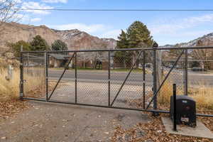 View of gate with a mountain view