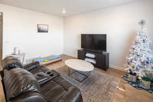 Living room with hardwood / wood-style floors