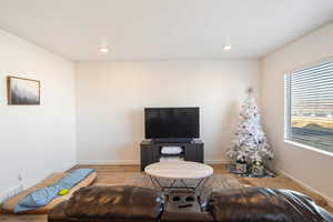 Living room with light wood-type flooring