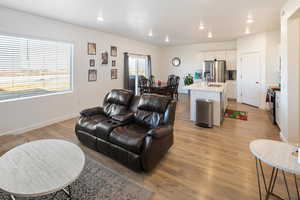 Living room featuring light hardwood / wood-style flooring and sink