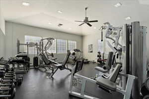 Gym with ceiling fan and vaulted ceiling