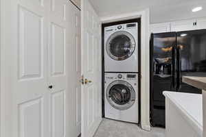 Clothes washing area with stacked washer / dryer