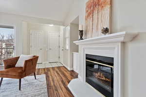 Interior space with light hardwood / wood-style floors and lofted ceiling