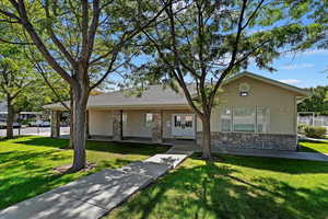 Ranch-style home with a front yard