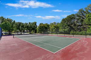 View of tennis court with basketball court