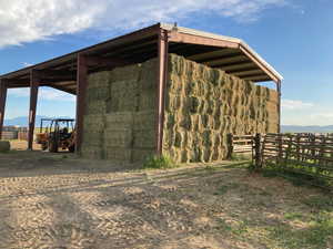 View of steel outbuilding with 1st crop of hay inside