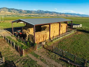 View of outdoor structure with a mountain view and a rural view