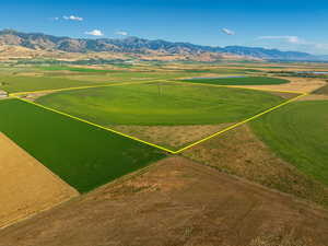 Birds eye view of property with a mountain view and a rural view