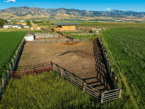 Birds eye view of property with a mountain view and a rural view