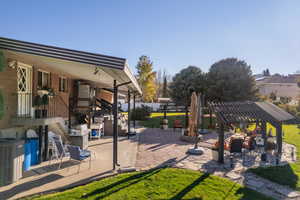 View of patio featuring a pergola and central AC