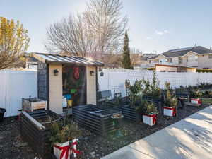 View of yard with a storage unit