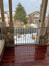 View of snow covered back of property