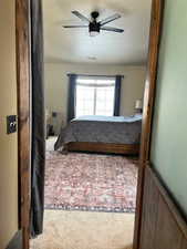 Bedroom featuring carpet flooring and ceiling fan