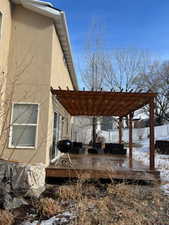 Exterior space featuring a pergola and a deck