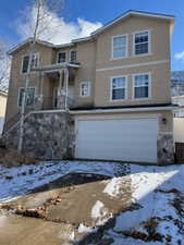 Front of property with a garage