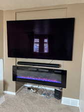 Details with carpet flooring and a textured ceiling