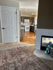 Kitchen with dark brown cabinetry and white appliances