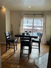 Dining room featuring a textured ceiling