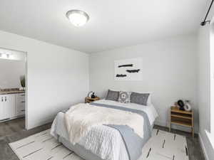 Bedroom featuring carpet floors and ensuite bath